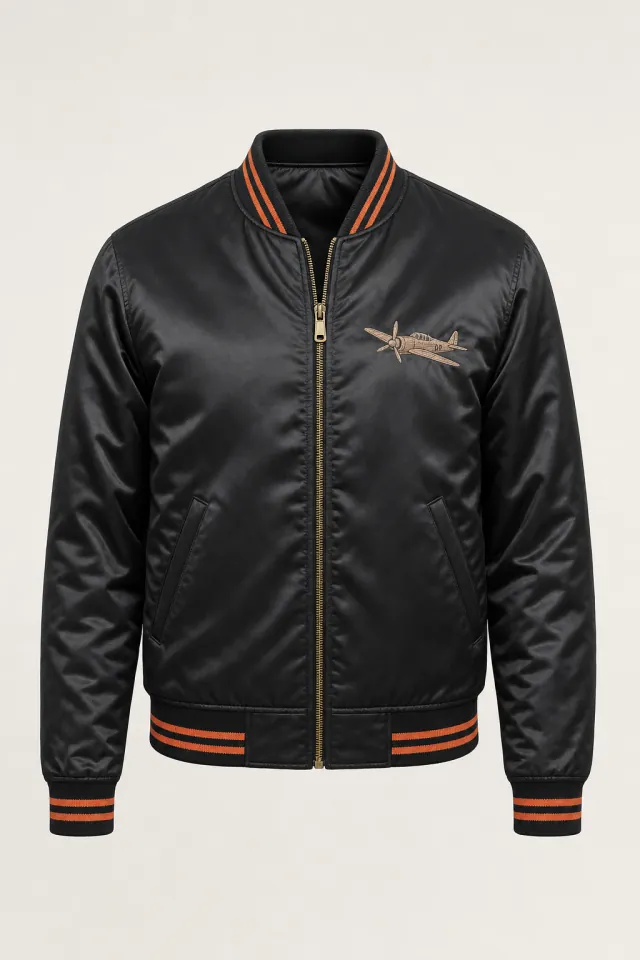 Black satin souvenir jacket with orange-striped rib trims and an embroidered aircraft on the chest